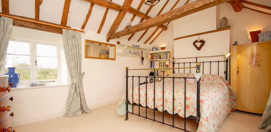 a warm floral loft room